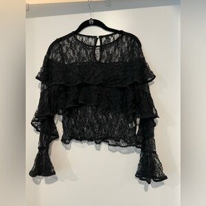 Lace long sleeve black top. Perfect for a night out!